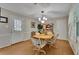 Bright dining room with a chandelier, light walls, and wood floors at 1125 Lanier Sw Dr, Marietta, GA 30060