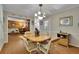 A dining room featuring a wood table, seating for six, and access to the living room, promoting an open and inviting atmosphere at 1125 Lanier Sw Dr, Marietta, GA 30060