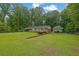 Beautifully landscaped yard surrounds this inviting single-story brick home at 1125 Lanier Sw Dr, Marietta, GA 30060