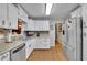 Bright kitchen with updated stainless steel appliances, granite countertops, and ample cabinet space at 1125 Lanier Sw Dr, Marietta, GA 30060