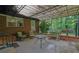 Covered brick patio with outdoor seating provides a relaxing entertainment space and grilling area at 1125 Lanier Sw Dr, Marietta, GA 30060