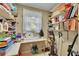 A functional storage space with extensive shelving, providing versatile solutions for organizing household items and seasonal decorations at 1125 Lanier Sw Dr, Marietta, GA 30060