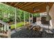Charming outdoor area with picnic tables, fan, and shade, perfect for Gathering gatherings and relaxation at 1626 Gilstrap Nw Ln, Atlanta, GA 30318