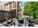 Inviting backyard seating area features pavers, gravel, a fire pit, and comfortable seating for outdoor gatherings at 1626 Gilstrap Nw Ln, Atlanta, GA 30318