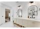 Stylish bathroom with double vanity, modern fixtures, and basket storage at 1626 Gilstrap Nw Ln, Atlanta, GA 30318