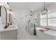 Elegant bathroom featuring a soaking tub, walk-in shower, and double vanity at 1626 Gilstrap Nw Ln, Atlanta, GA 30318