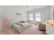 bedroom with bed frame, pink rug, and natural light at 1626 Gilstrap Nw Ln, Atlanta, GA 30318