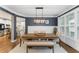 Charming dining area featuring hardwood floors, a farmhouse table, and natural light at 1626 Gilstrap Nw Ln, Atlanta, GA 30318