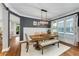 Elegant dining room with hardwood floors, stylish lighting, and a cozy bench at 1626 Gilstrap Nw Ln, Atlanta, GA 30318