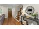 Stylish entryway with hardwood floors, staircase, and decorative accents at 1626 Gilstrap Nw Ln, Atlanta, GA 30318