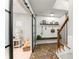 Entryway with brick floors, sliding glass door, and wooden staircase at 1626 Gilstrap Nw Ln, Atlanta, GA 30318