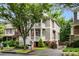 Charming two-story home featuring a welcoming front porch, mature tree, and lovely landscaping at 1626 Gilstrap Nw Ln, Atlanta, GA 30318