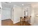 Hallway with hardwood floors that leads to a bedroom with a ceiling fan at 1626 Gilstrap Nw Ln, Atlanta, GA 30318