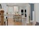 Beautiful open kitchen design with a large island, white cabinets and a view of the porch at 1626 Gilstrap Nw Ln, Atlanta, GA 30318