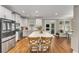 Modern kitchen with stainless steel appliances, white cabinets, and a spacious center island at 1626 Gilstrap Nw Ln, Atlanta, GA 30318