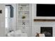 Fireplace focal point with built-in shelves and cabinets in a cozy living room at 1626 Gilstrap Nw Ln, Atlanta, GA 30318