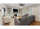 Bright living room with fireplace, built-ins, and large windows at 1626 Gilstrap Nw Ln, Atlanta, GA 30318