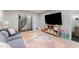 Cozy living room with large tv, soft rug, and comfortable couch at 1626 Gilstrap Nw Ln, Atlanta, GA 30318