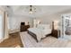 Bright main bedroom with a tray ceiling, wood floors, and a large rug at 1626 Gilstrap Nw Ln, Atlanta, GA 30318