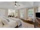 Serene main bedroom with tray ceilings, natural light, and a cozy seating area at 1626 Gilstrap Nw Ln, Atlanta, GA 30318