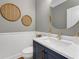 Stylish powder room with a modern vanity, elegant mirror, and wainscoting detail at 1626 Gilstrap Nw Ln, Atlanta, GA 30318