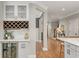 Wet bar area with glass cabinets, a wine rack, and beverage cooler, perfect for entertaining at 1626 Gilstrap Nw Ln, Atlanta, GA 30318