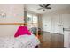 Bedroom featuring hardwood floors, a ceiling fan, closet doors, and natural light from the window at 172 Olympic Pl, Decatur, GA 30030