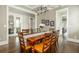 Elegant dining room with hardwood floors, coffered ceilings, stylish chandelier, and plenty of seating at 172 Olympic Pl, Decatur, GA 30030