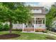 Charming front porch with a swing, rocking chairs, and manicured landscaping enhancing the curb appeal of this lovely home at 172 Olympic Pl, Decatur, GA 30030