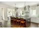Modern kitchen with a large island, granite countertops, and stainless steel appliances at 172 Olympic Pl, Decatur, GA 30030