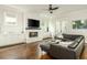 Inviting living room with a fireplace, built-in cabinets, large windows, and comfortable seating at 172 Olympic Pl, Decatur, GA 30030