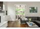 Elegant living room boasts hardwood floors, doors to outdoor patio, and stylish decor at 172 Olympic Pl, Decatur, GA 30030