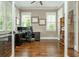 Bright home office featuring hardwood floors, built-in shelving, and ample natural light at 172 Olympic Pl, Decatur, GA 30030