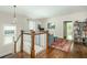 Upstairs hallway with beautiful hardwood floors, leading to bedrooms and living area at 172 Olympic Pl, Decatur, GA 30030