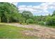 Large backyard, offering plenty of space for gardening and recreation at 1960 W Hightower Trl, Conyers, GA 30012