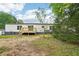 The back of the home with a new wooden deck and spacious backyard at 1960 W Hightower Trl, Conyers, GA 30012