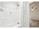 Bright bathroom featuring a tub, shower, and built in shelving at 1960 W Hightower Trl, Conyers, GA 30012