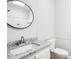 Bathroom featuring a granite countertop, modern sink, and decorative mirror at 1960 W Hightower Trl, Conyers, GA 30012