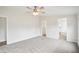 Spacious bedroom features neutral carpet and access to a walk-in closet and bathroom, creating a serene retreat at 1960 W Hightower Trl, Conyers, GA 30012