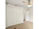 This bedroom features neutral carpeting, a ceiling fan, and a closet at 1960 W Hightower Trl, Conyers, GA 30012