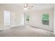Bedroom with multiple windows, neutral carpet and bright, airy atmosphere at 1960 W Hightower Trl, Conyers, GA 30012