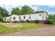 Charming single-story home with white siding and well-maintained landscaping at 1960 W Hightower Trl, Conyers, GA 30012
