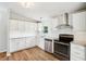 Modern kitchen with stainless steel appliances, granite counters and white cabinets at 1960 W Hightower Trl, Conyers, GA 30012