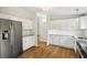 Kitchen with white cabinets, stainless appliances, and granite counters at 1960 W Hightower Trl, Conyers, GA 30012