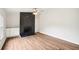 Bright living room featuring a black brick fireplace and light wood flooring at 1960 W Hightower Trl, Conyers, GA 30012