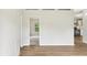Bright and airy living room featuring wood flooring and white walls at 1960 W Hightower Trl, Conyers, GA 30012