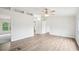 Spacious living room with wood flooring, white walls, and ample natural light at 1960 W Hightower Trl, Conyers, GA 30012