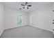 Neutral bedroom with carpet flooring, ceiling fan and natural light at 1965 Tiner Ct, Cumming, GA 30041