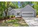 Charming one-story home with a two-car garage, inviting curb appeal, and well-maintained landscaping at 1965 Tiner Ct, Cumming, GA 30041