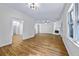 Large living space with hardwood floors, white walls, a fireplace, recessed lighting and a ceiling fan at 1965 Tiner Ct, Cumming, GA 30041